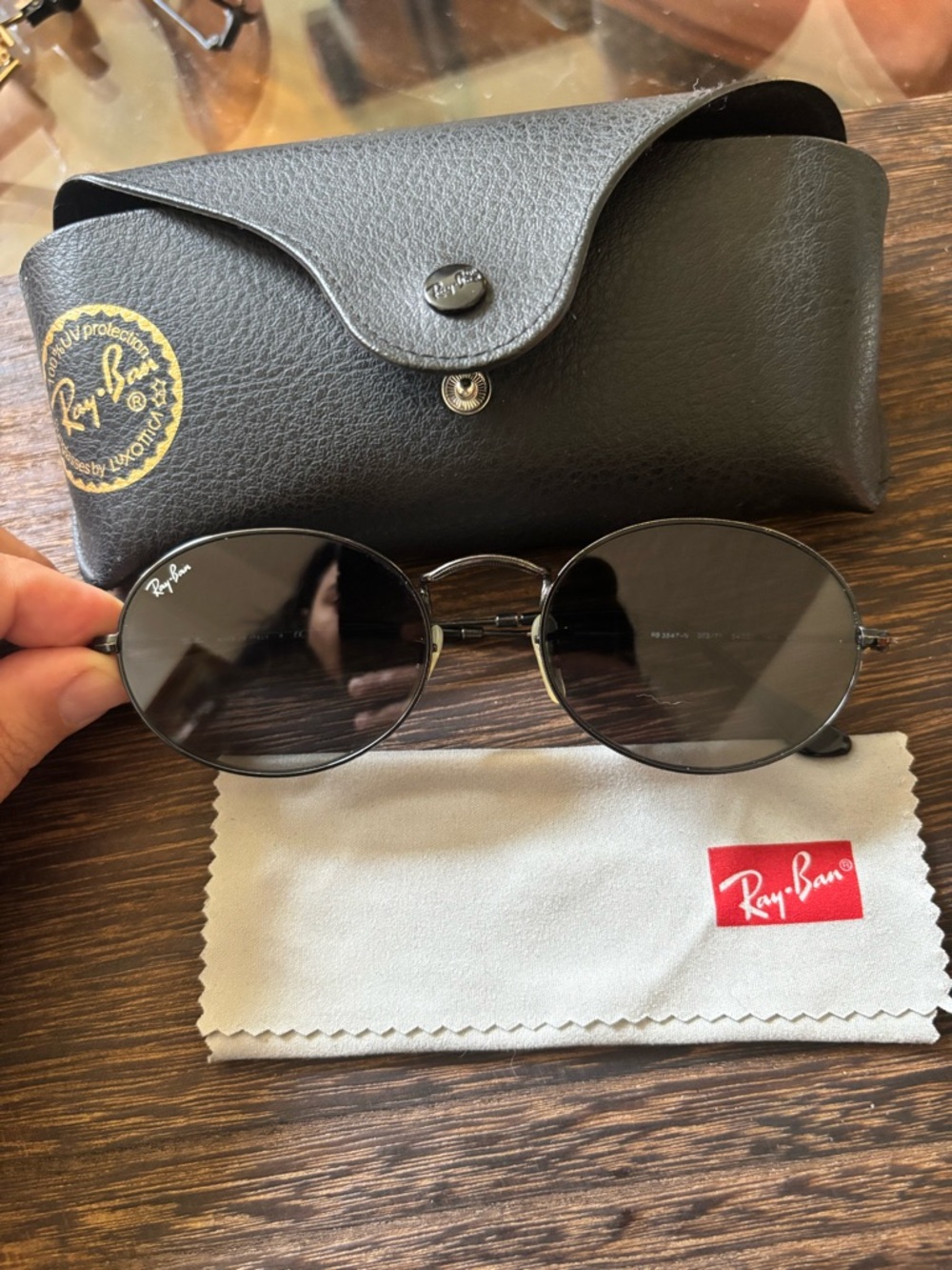 Ray-Ban Unisex Black Oval Sunglasses with Dark Lenses